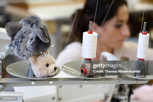 Worker sews at the Steiff stuffed toy factory on November 23, 2012 in Giengen an der Brenz, Germany. Founded by seamstress Margarethe Steiff in 1880,...