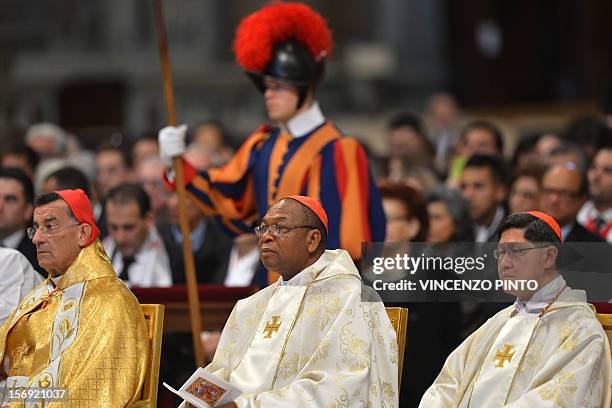 Newly appointed cardinals Colombia's Ruben Salazar Gomez, Nigeria's John Onaiyekan and Luis Antonio Tagle of the Philippines listen during a Holy...