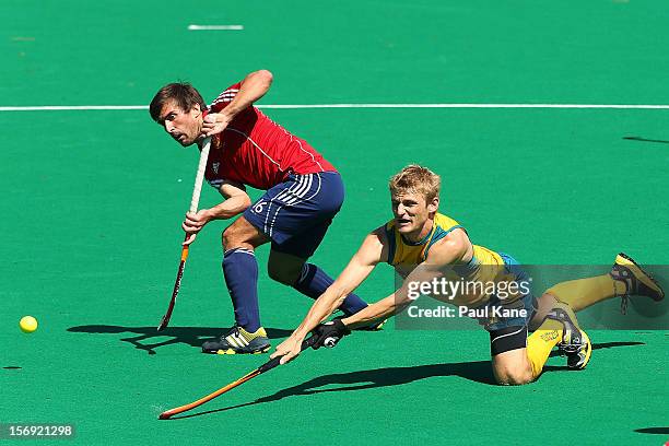 Craig Boyne of the Kookaburras takes a shot on goal against Adam Dixon of England in the gold medal match between the Australian Kookaburras and...