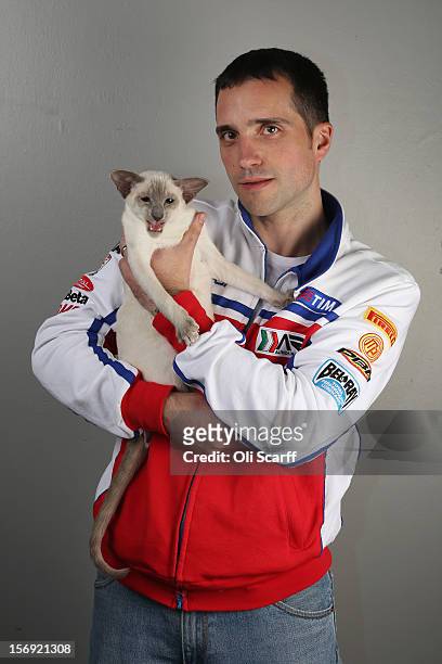 Nathan Smith poses for a photograph with his Caramel Point Siamese cat named 'Prince Soloman' after being exhibited at the Governing Council of the...