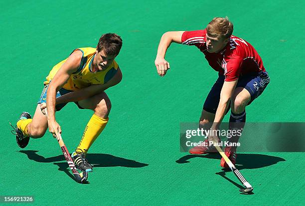 Oliver Willars of England tackles Matthew Gohdes of the Kookaburras in the gold medal match between the Australian Kookaburras and England during day...