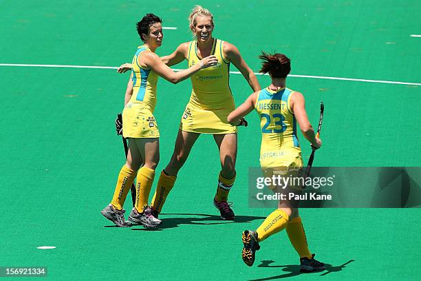 Teneal Attard and Jodie Schulz of the Hockeyroos celebrate a goal in the gold medal match between the Australian Hockeyroos and the Australian...