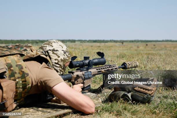 Ukrainian military member with sniper rifle on the military outdoor firing range on July 5, 2023 in Donetsk Oblast, Ukraine.