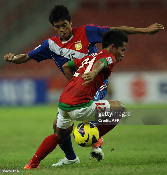 Indonesia's player Andik Vermansah fights for the ball with Laos's player Viengsavanh Sayyaboun during their AFF Suzuki Cup group B football match in...