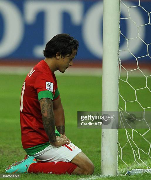 Indonesia's player Irfan Haarys Bachdim reacts after missing a goal against Laos during their AFF Suzuki Cup group B football match in Bukit Jalil...