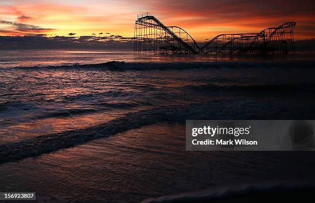 Roller coaster sits in the ocean after the Casino Pier collapsed when Superstorm Sandy hit, on November 25, 2012 in Seaside Heights, New Jersey....