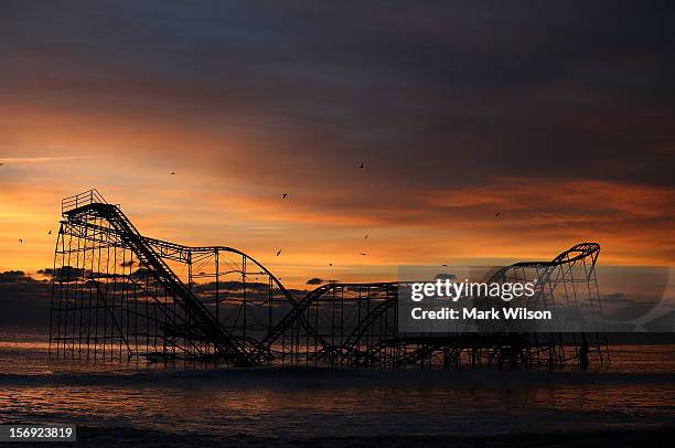 Roller coaster sits in the ocean after the Casino Pier collapsed when Superstorm Sandy hit, on November 25, 2012 in Seaside Heights, New Jersey....