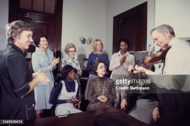 Senator Robert Byrd of West Virginia plays the violin for members of his staff after announcing his candidacy for the Democratic Presidential...