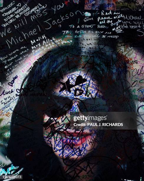 Poster of Michael Jackson gathers more and more notes and best wishes from fans on the makeshift shrine at his star on the Hollywood Walk of Fame in...