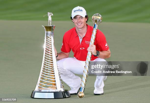 Rory McIlroy of Northern Ireland with both the Race To Dubai and DP World Tour Championship trophies after winning the DP World Tour Championship on...