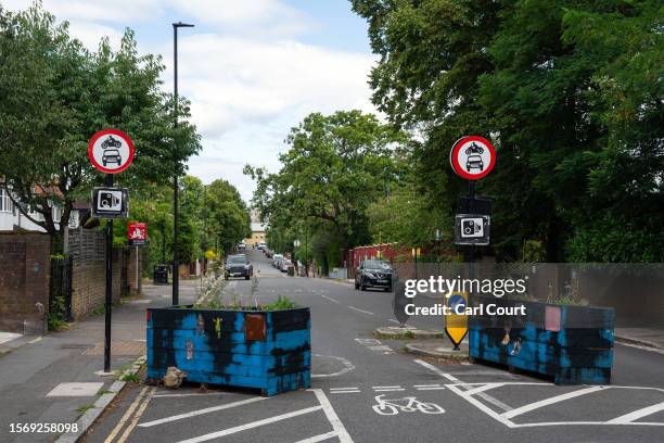 Low traffic neighbourhood barrier blocks a residential road on August 1, 2023 in London, England. Prime Minister Rishi Sunak has called for a review...