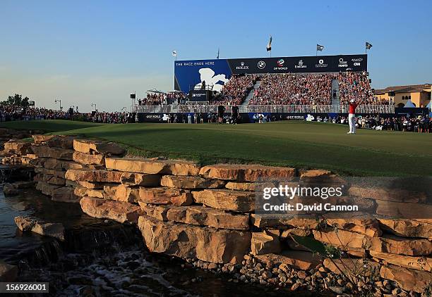 Rory McIlroy of Northern Ireland holes the winning putt at the par 5, 18th hole during the final round of the 2012 DP World Tour Championship on the...