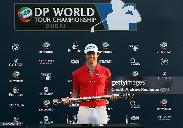 Rory McIlroy of Northern Ireland poses with the trophy after winning the DP World Tour Championship on the Earth Course at Jumeirah Golf Estates on...