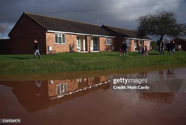 Flood water continues to block the main road through the centre of the village of Ruishton, near Taunton, on November 25, 2012 in Somerset, England....