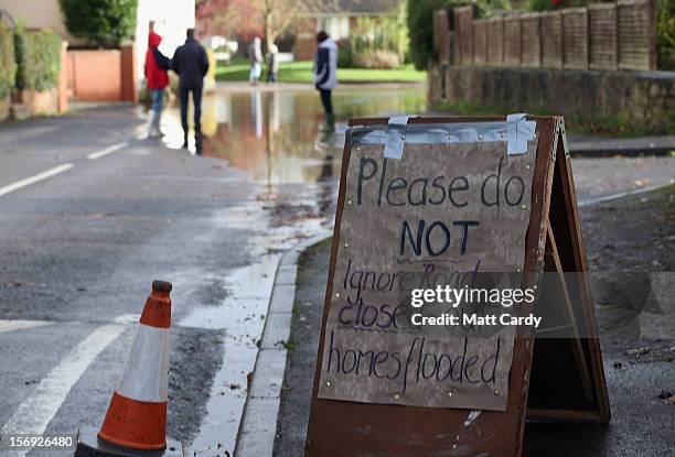 Sign asks motorists not to drive through flood water in the centre of the village of Ruishton, near Taunton, on November 25, 2012 in Somerset,...