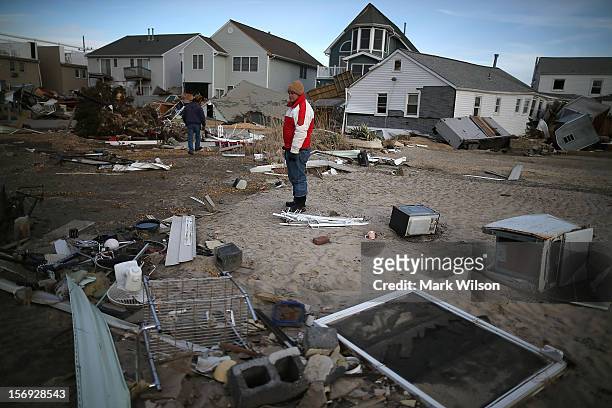 David Mccue , looks for pieces of his beach house that was completely demolished by Superstorm Sandy on November 25, 2012 in Ortley Beach, New...