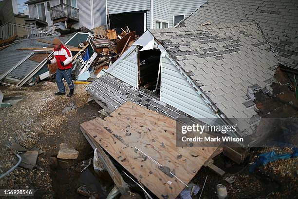 David Mccue stands near the roof to his beach house that was completely demolished by Superstorm Sandy on November 25, 2012 in Ortley Beach, New...