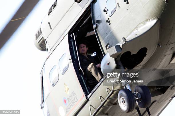 Tom Cruise is sighted flying in an RAF helicopter on set for the movie 'All You Need Is Kill' being filmed in Trafalgar Square on November 25, 2012...