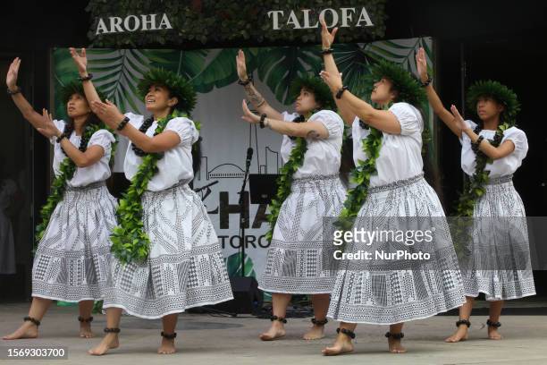 Women perform a traditional Polynesian dance during the Aloha Festival in Toronto, Ontario, Canada, on July 29, 2023. The Aloha Festival celebrated...