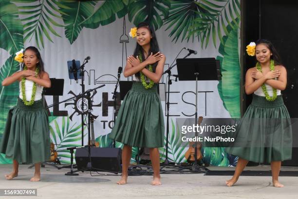 Girls perform a traditional Polynesian dance during the Aloha Festival in Toronto, Ontario, Canada, on July 29, 2023. The Aloha Festival celebrated...