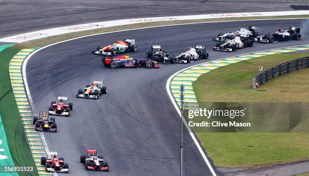 Sebastian Vettel of Germany and Red Bull Racing spins after being involved in an incident with Bruno Senna of Brazil and Williams during the...