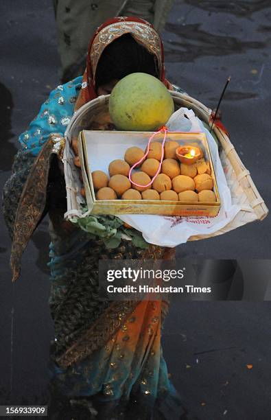 Thousands of devotees celebrate ‘Chhath Puja’, taking holy dip in ponds and paying obeisance to the setting Sun at Sheetla Mata mandir on November 19...