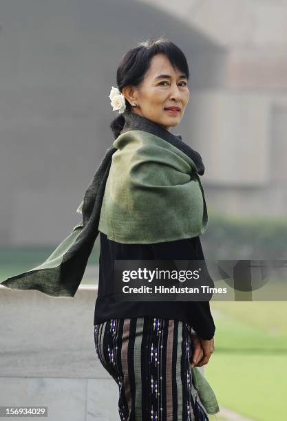 Chairperson of The National League for Democracy of Myanmar, Aung San Suu Kyi smiles after paying tribute at Rajghat, The Memorial to Mahatma Gandhi...