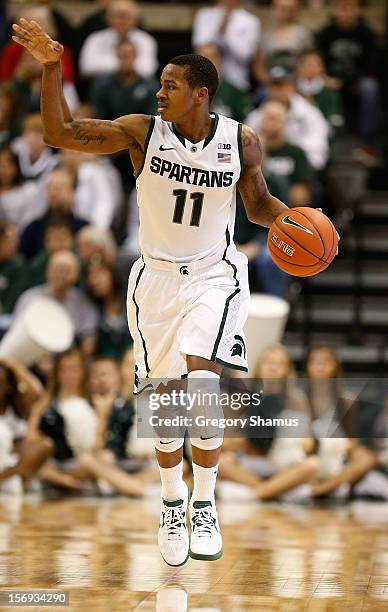 Keith Appling of the Michigan State Spartans brings the ball up the floor in the first half while playing the Louisiana-Lafayette Ragin' Cajuns at...