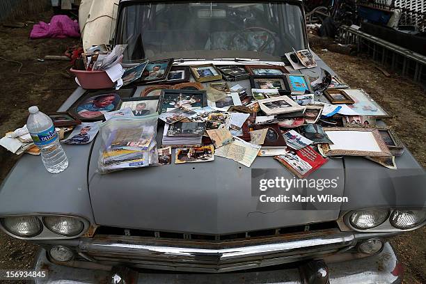 Old photographs are laid out to dry on a car hood a car hood after being removed from a home flooded by Superstorm Sandy, on November 25, 2012 in...