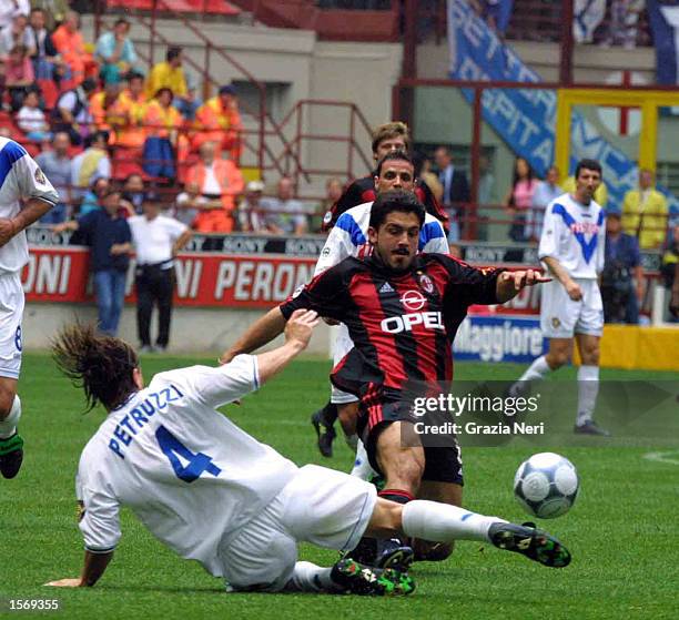 Gennaro Gattuso of AC Milan and Fabio Petruzzi of Brescia in action during the Serie A 33rd Round League match between AC Milan and Brescia played at...