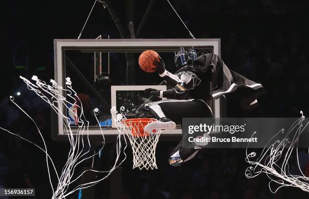 The mascot for the Brooklyn Nets, the BrooklyKnight flies in to score two during a break in the game between the Brooklyn Nets and the Los Angeles...