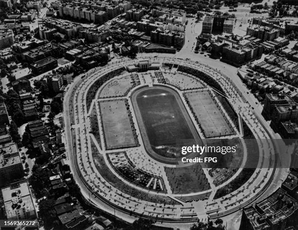 High-angle view of the Williamsbridge Oval, with basketball courts, an athletic field, and tennis courts, in the Bronx borough of New York City, New...
