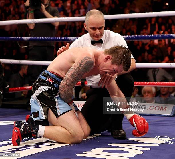 Ricky Hatton of Great Britain fails to get up after being knocked down by Vyacheslav Senchenko of Ukraine during their Welterweight bout at the MEN...