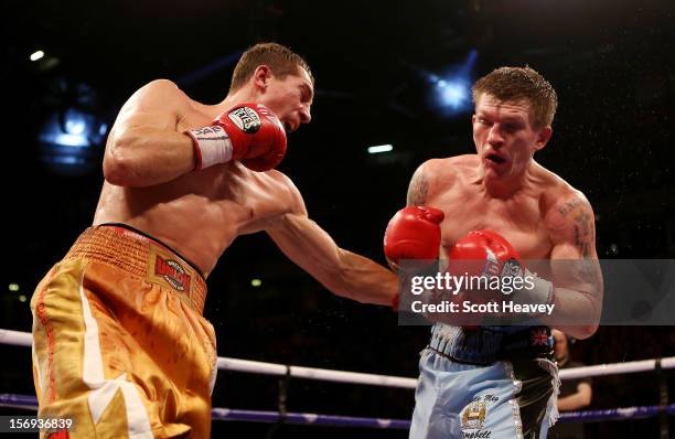 Ricky Hatton of Great Britain is caught by Vyacheslav Senchenko of Ukraine during their Welterweight bout at the MEN Arena on November 24, 2012 in...