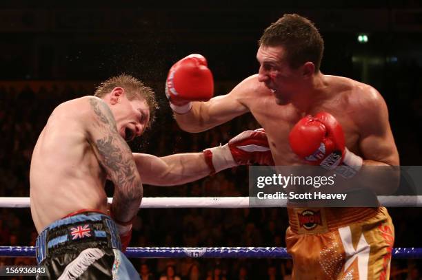 Ricky Hatton of Great Britain is caught by Vyacheslav Senchenko of Ukraine during their Welterweight bout at the MEN Arena on November 24, 2012 in...