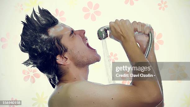 man singing in the shower with a mohawk - singing shower stock pictures, royalty-free photos & images