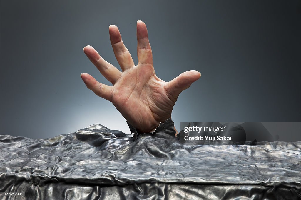 Man hand  coming out from lead