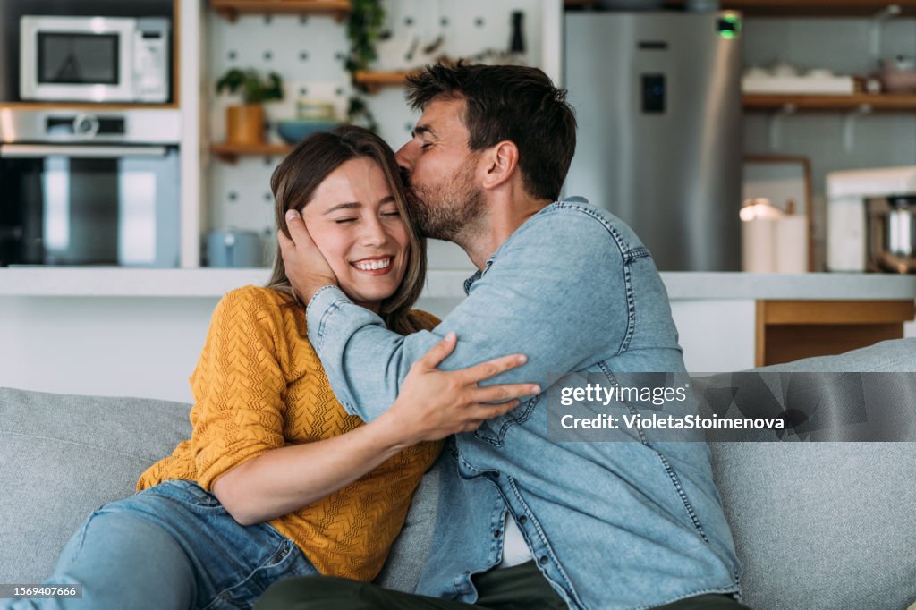 Happy couple at home.