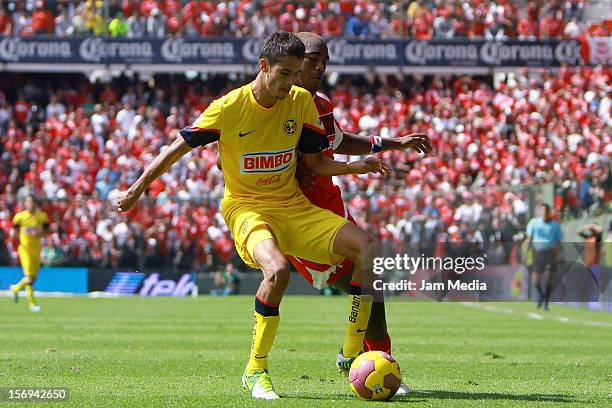 Luis Tejada of Toluca fights for the ball with Diego Reyes of America during a match between Toluca and America as part of the Apertura 2012 Liga MX...