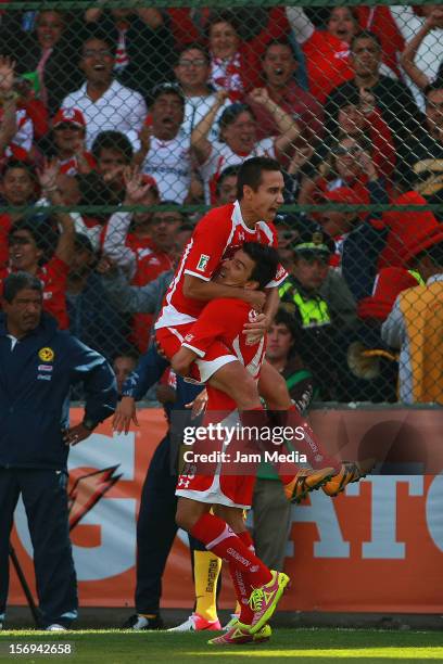 Edgar Benitez and Gerardo Rodriguez of Toluca celebrate a goal against America during a match between Toluca and America as part of the Apertura 2012...