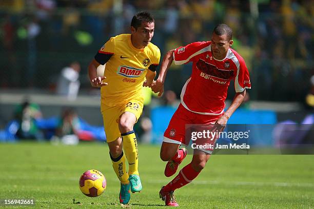 Lucas Silva of Toluca fights for the ball with Paul Aguilar of America during a match between Toluca and America as part of the Apertura 2012 Liga MX...