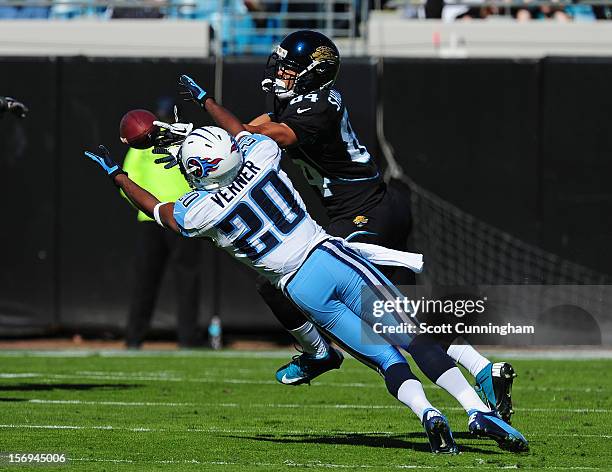 Alterraun Verner of the Tennessee Titans intercepts a pass intended for Cecil Shorts III of the Jacksonville Jaguars at EverBank Field on November...