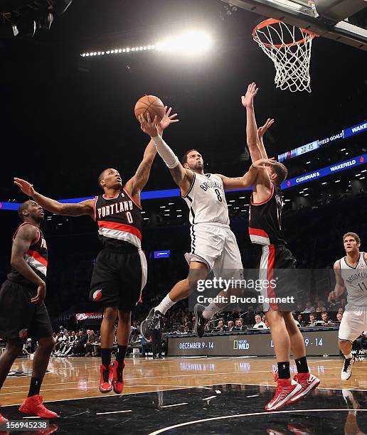 Deron Williams of the Brooklyn Nets scores two late in the fourth quarter against the Portland Trail Blazers at the Barclays Center on November 25,...