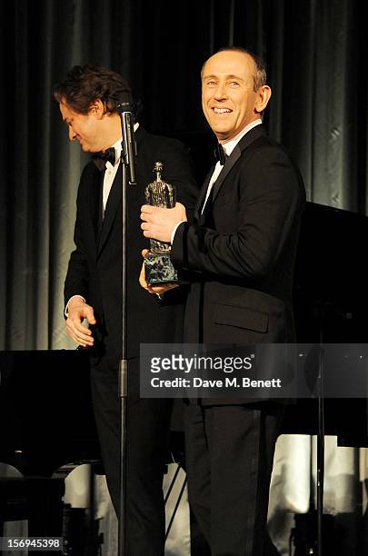 Nicholas Hytner accepts the Best Director award from Colin Firth at the 58th London Evening Standard Theatre Awards in association with Burberry at...