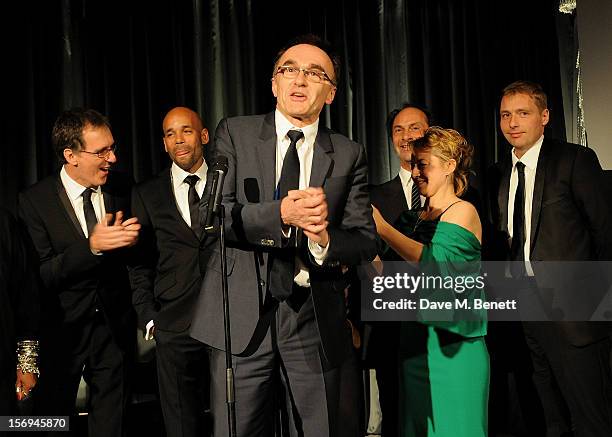 Danny Boyle and his team from the London 2012 Opening Ceremony accept the Beyond Theatre award at the 58th London Evening Standard Theatre Awards in...