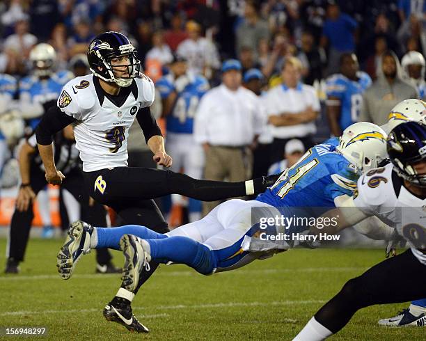 Justin Tucker of the Baltimore Ravens kicks a game winning field goal by Corey Lynch of the San Diego Chargers for a 16-13 win at Qualcomm Stadium on...