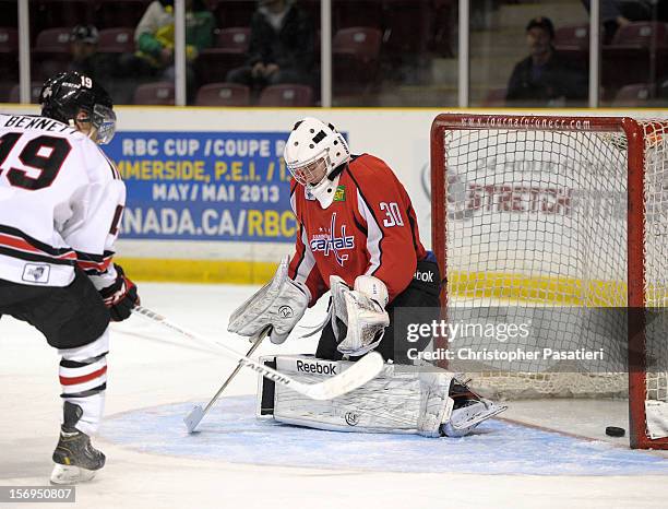 Jacob Riley of the Summerside Western Capitals allows a goal during the second period against the Weeks Crushers on November 25, 2012 at the...