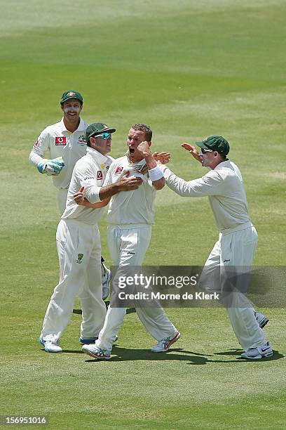 Peter Siddle of Australia celebrates after bowling out AB de Villiers of South Africa during day five of the Second Test Match between Australia and...
