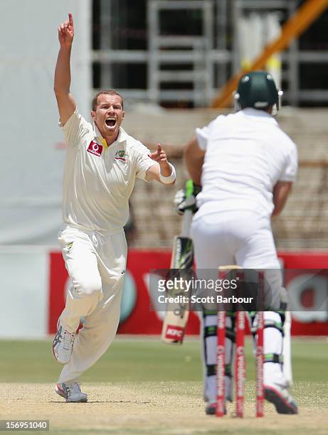 Peter Siddle of Australia celebrates after bowling AB de Villiers of South Africa during day five of the Second Test Match between Australia and...