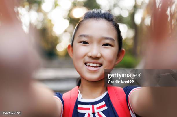 little daughter taking selfies - cute college girl stock pictures, royalty-free photos & images